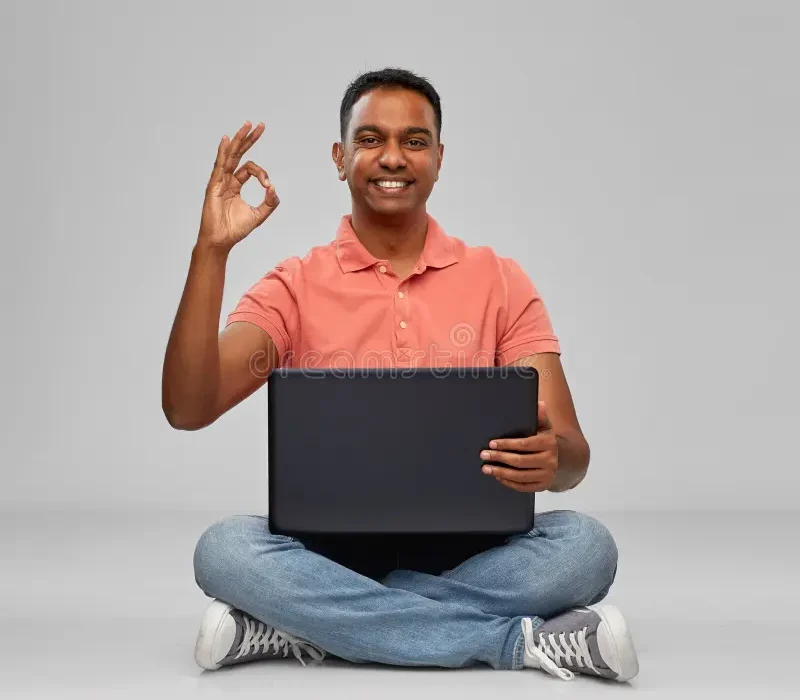 happy-indian-man-laptop-computer-showing-ok-technology-internet-communication-people-concept-sitting-floor-hand-sign-166188237